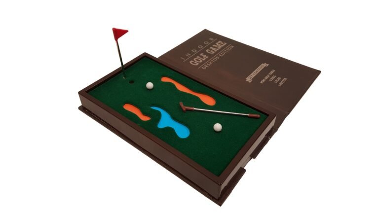 Miniature indoor golf game set with green felt, obstacles, and accessories
