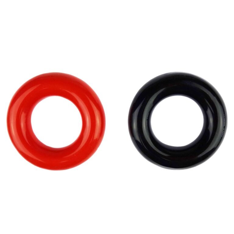 Two glossy, circular objects: one red, one black, on a white background