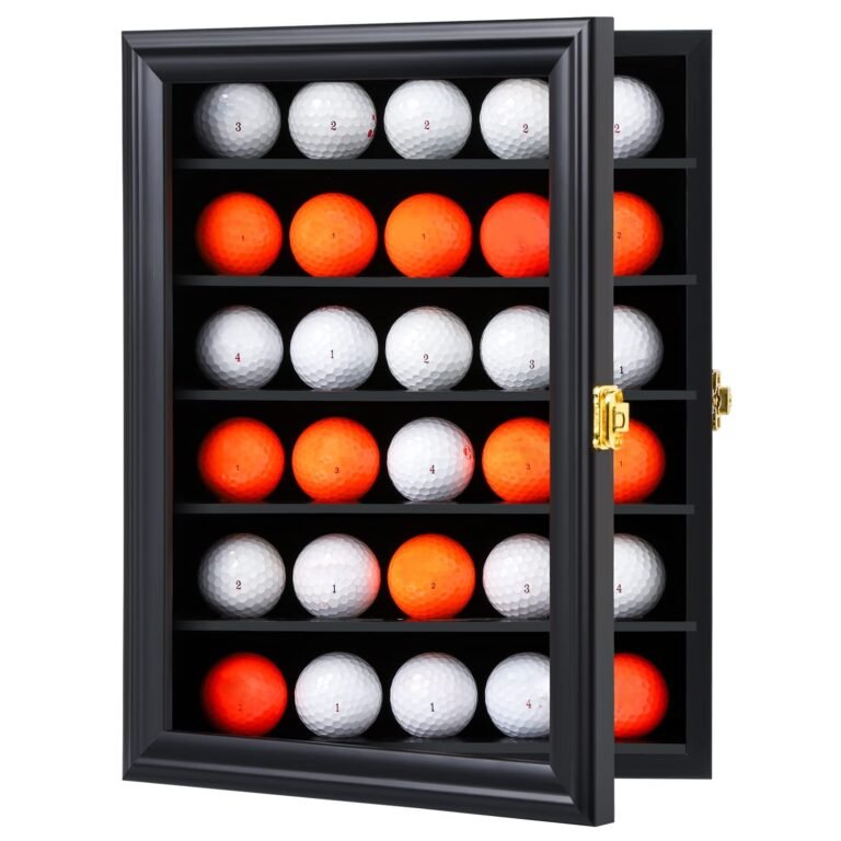 Black display case with golf balls, some white, some orange, numbered